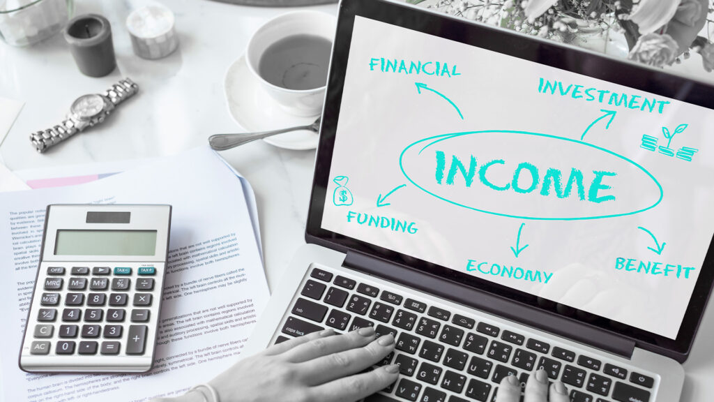 a calculator and a laptop displaying different ways to get an income.